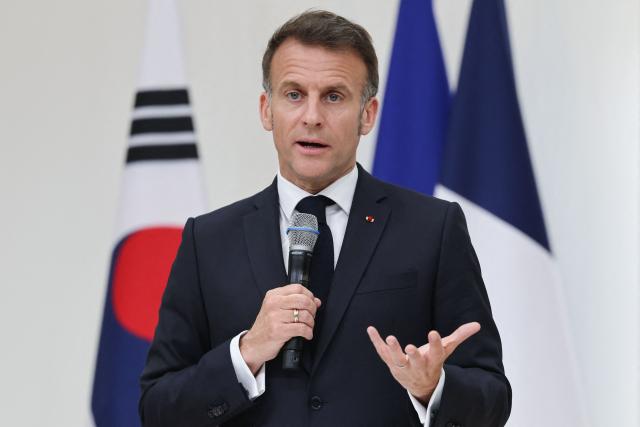 French President Emmanuel Macron speaks during a meeting with students at Yonsei University in Seoul on April 3, 2026. (Photo by Ludovic MARIN / AFP)