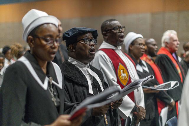 Christians from various denominations gesture during  Good Friday prayer at the International Convention Centre (ICC) in Durban on April 3, 2026. (Photo by RAJESH JANTILAL / AFP)