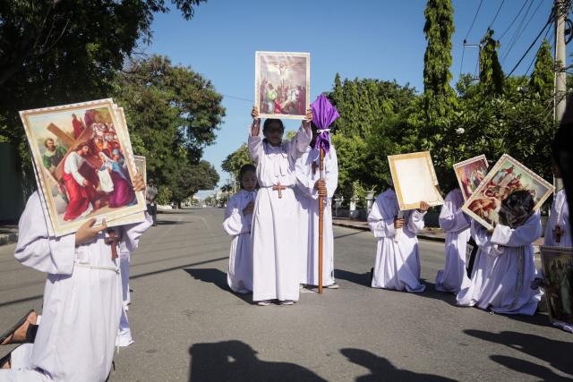 Catholic devotees take part in a Good Friday procession from Balide Church in Dili on April 3, 2026. (Photo by VALENTINO DARIELL DE SOUSA / AFP)