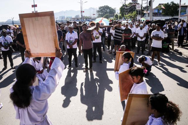 Catholic devotees take part in a Good Friday procession from Balide Church in Dili on April 3, 2026. (Photo by VALENTINO DARIELL DE SOUSA / AFP)
