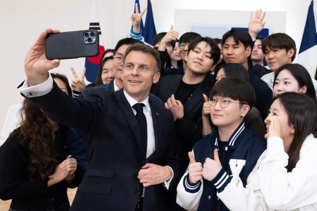 French President Emmanuel Macron attends a meeting with students at Yonsei University in Seoul on April 3, 2026. (Photo by Jeanne Accorsini / POOL / AFP)