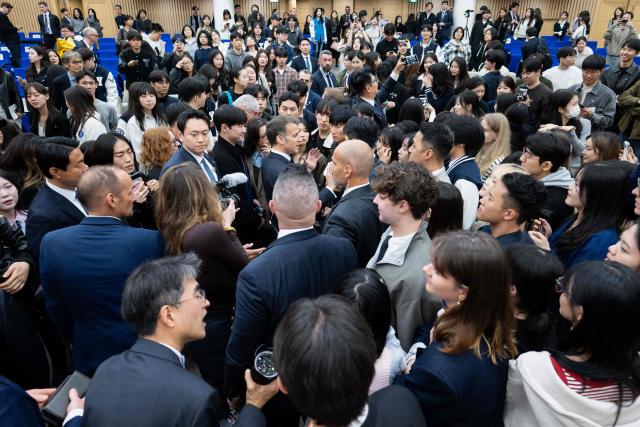 French President Emmanuel Macron attends a meeting with students at Yonsei University in Seoul on April 3, 2026. (Photo by Jeanne Accorsini / POOL / AFP)