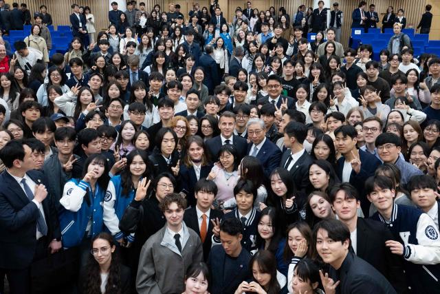 French President Emmanuel Macron attends a meeting with students at Yonsei University in Seoul on April 3, 2026. (Photo by Jeanne Accorsini / POOL / AFP)