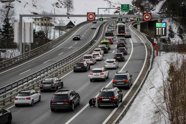 Easter holidaymakers queue in their cars on the A2 motorway on their way to the northern entrance of the Gotthard Road Tunnel near the village of Wassen, on April 3, 2026, as traffic builds up to a 19-kilometre jam with a waiting time of around 190 minutes, according to the Touring Club Suisse (TCS). (Photo by Fabrice COFFRINI / AFP)