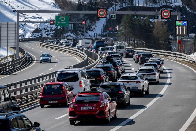 Easter holidaymakers queue in their cars on the A2 motorway on their way to the northern entrance of the Gotthard Road Tunnel near the village of Wassen, on April 3, 2026, as traffic builds up to a 19-kilometre jam with a waiting time of around 190 minutes, according to the Touring Club Suisse (TCS). (Photo by Fabrice COFFRINI / AFP)