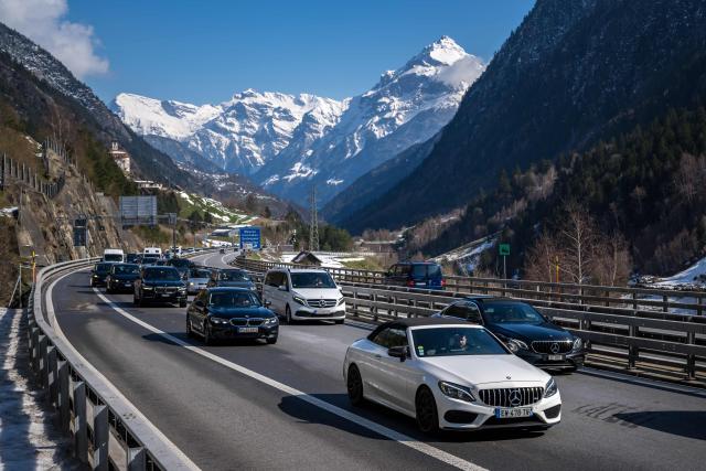 Easter holidaymakers queue in their cars on the A2 motorway on their way to the northern entrance of the Gotthard Road Tunnel near the village of Wassen, on April 3, 2026, as traffic builds up to a 19-kilometre jam with a waiting time of around 190 minutes, according to the Touring Club Suisse (TCS). (Photo by Fabrice COFFRINI / AFP)