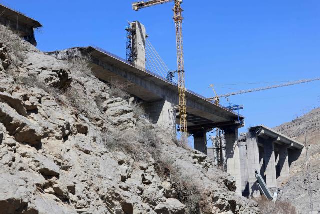A view of the B1 bridge is pictured, a day after it was destroyed by a strike in Karaj, around 20miles (35kms) southwest of Tehran, April 3, 2026. US President Donald Trump said on April 2 the tallest bridge in Iran had been destroyed, hours after threatening to bomb the country "back to the Stone Ages." (Photo by ATTA KENARE / AFP)