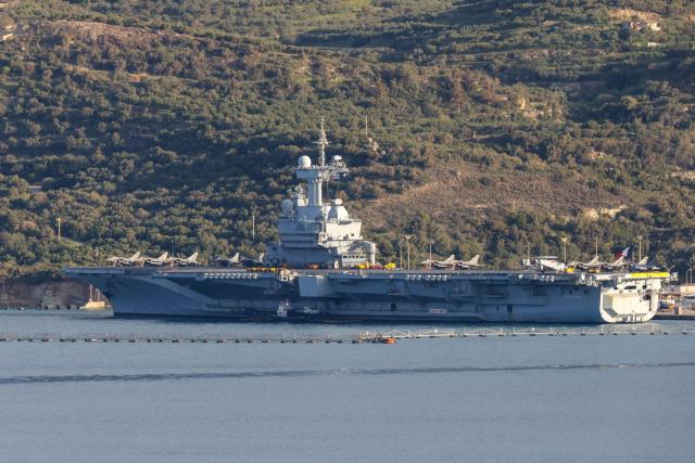 This photograh shows a view of France’s aircraft carrier Charles de Gaulle at Souda Bay on the island of Crete on April 3, 2026. (Photo by Costas METAXAKIS / AFP)