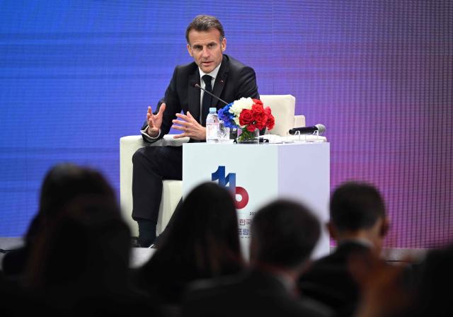 French President Emmanuel Macron speaks during a French-Korean business forum in Seoul on April 3, 2026. (Photo by Jung Yeon-je / AFP)