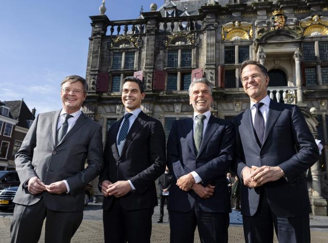 Prime Minister Rob Jetten (2nd L) with his predecessors Jan Peter Balkenende (L), Dick Schoof (2nd R) and Mark Rutte (R) pose before attending a performance of the St Matthew Passion in the Nieuwe Kerk church on April 3, 2026. (Photo by Remko de Waal / ANP / AFP) / Netherlands OUT