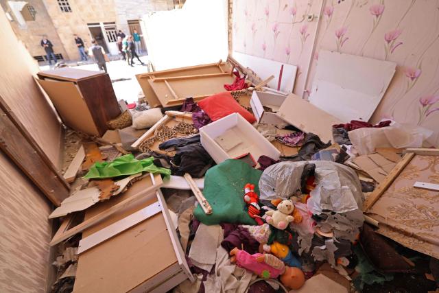 Stuffed toys lie amid the debris of a residential building that was damaged by recent strikes at Vahdat town in Karaj, southwest of Tehran on April 3, 2026. Iran and its allies traded fire with Israel and the United States, as Washington-linked assets across the Middle East were targeted alongside civilian infrastructure -- with the month-long war on April 3 showing little sign of easing. (Photo by ATTA KENARE / AFP) / 
