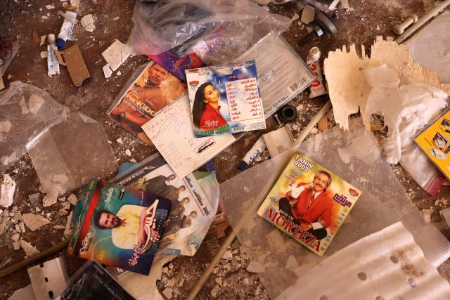 Entertainment compact discs lie amid the debris of a residential apartment that was damaged by recent strikes at Vahdat town in Karaj, southwest of Tehran on April 3, 2026. Iran and its allies traded fire with Israel and the United States, as Washington-linked assets across the Middle East were targeted alongside civilian infrastructure -- with the month-long war on April 3 showing little sign of easing. (Photo by ATTA KENARE / AFP) / 