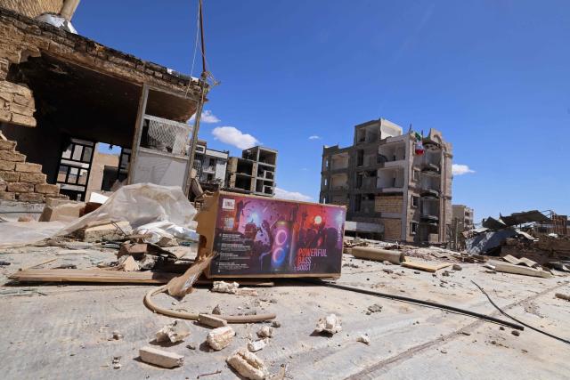 Residential buildings that were damaged by recent strikes are pictured at Vahdat town in Karaj, southwest of Tehran on April 3, 2026. Iran and its allies traded fire with Israel and the United States, as Washington-linked assets across the Middle East were targeted alongside civilian infrastructure -- with the month-long war on April 3 showing little sign of easing. (Photo by ATTA KENARE / AFP) / 