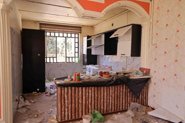 A portion of a residential apartment that was damaged by recent strikes is pictured at Vahdat town in Karaj, southwest of Tehran on April 3, 2026. Iran and its allies traded fire with Israel and the United States, as Washington-linked assets across the Middle East were targeted alongside civilian infrastructure -- with the month-long war on April 3 showing little sign of easing. (Photo by ATTA KENARE / AFP) / 