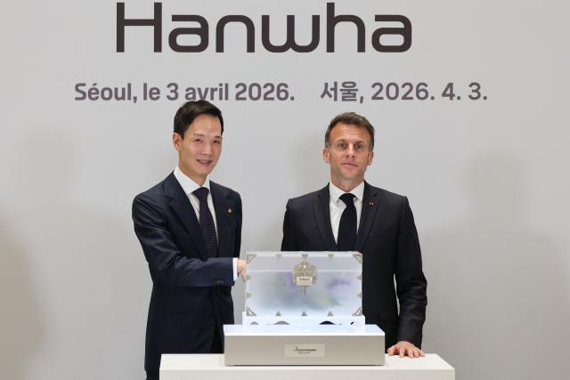 Hanwha Life CEO Kim Dong-won and French President Emmanuel Macron attend the inauguration of the Centre Pompidou Hanwha in Seoul on April 3, 2026. (Photo by Ludovic MARIN / AFP)