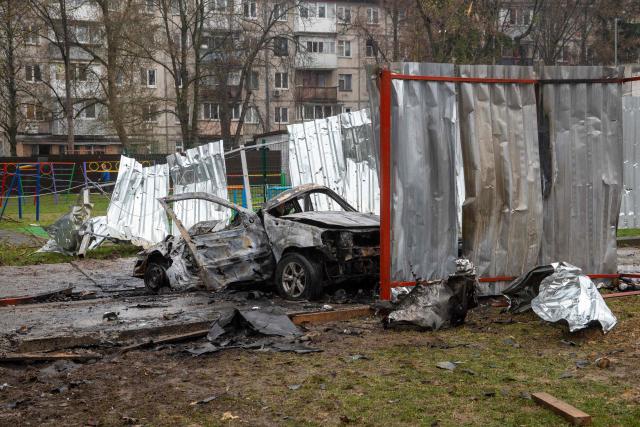 This photograph taken on April 3, 2026 shows a destroyed car in the courtyard of a residential building following an air attack in Vyshneve, Kyiv region, amid the Russian invasion of Ukraine. Ukraine on April 3, 2026 faced nearly 500 Russian missile and drone attacks that killed at least six people, officials said, the latest in an increasing number of daytime strikes by Moscow. (Photo by Serhii Okunev / AFP)