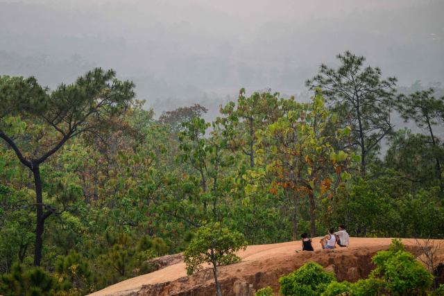 Tourists visit Kong Lan, or Pai Canyon, on a heavily polluted day in Pai on April 1, 2026, west of Thailand's second-largest city Chiang Mai. (Photo by ANTHONY WALLACE / AFP)