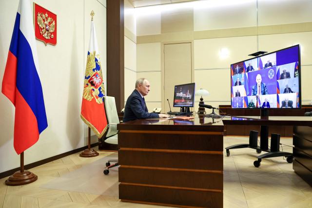 In this pool photograph distributed by the Russian state agency Sputnik, Russia's President Vladimir Putin chairs a Security Council meeting via videolink at the Novo-Ogaryovo state residence outside Moscow on April 3, 2026. (Photo by Alexander KAZAKOV / POOL / AFP)