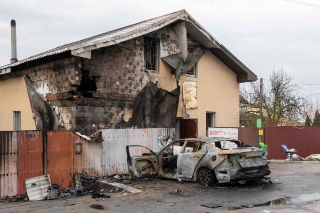 This photograph taken on April 3, 2026 shows a destroyed car next to a damaged veterinary clinic building following an air attack in Chabany, Kyiv region, amid the Russian invasion of Ukraine. Ukraine on April 3, 2026 faced nearly 500 Russian missile and drone attacks that killed at least six people, officials said, the latest in an increasing number of daytime strikes by Moscow. (Photo by Serhii Okunev / AFP)