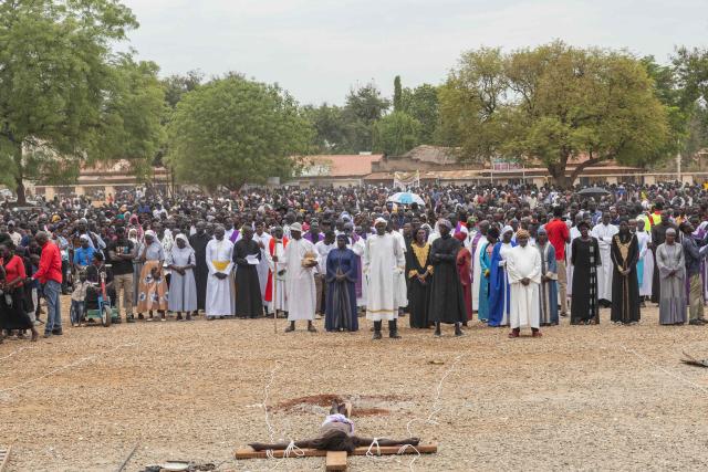 Thousands of Catholic worshippers gather at St. Theresa Cathedral Kator after completing a Good Friday procession in Juba on April 3, 2026. The joint church event commemorated the crucifixion of Jesus Christ and included prayers for peace in South Sudan. (Photo by Isaac Buay / AFP)