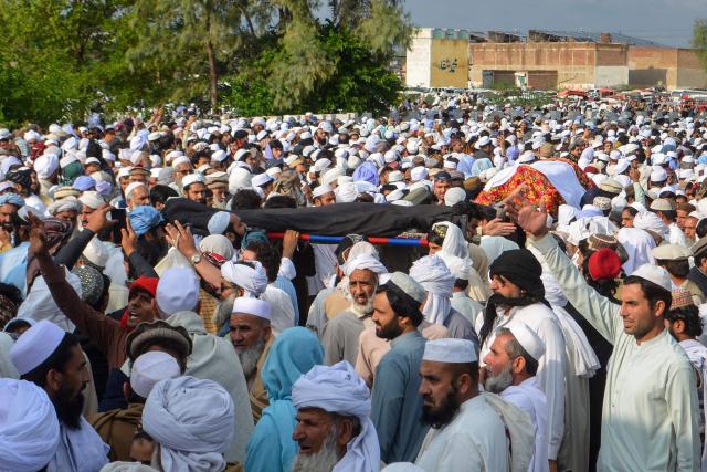 Mourners carry the coffins of victims ahead of funeral prayers following a suicide car bombing in Bannu, Pakistan's Khyber Pakhtunkhwa province on April 3, 2026. A suicide bomber in a vehicle laden with explosives killed at least three women and two children at a house in northwestern Pakistan late on April 2, local authorities said. (Photo by Karim ULLAH / AFP)