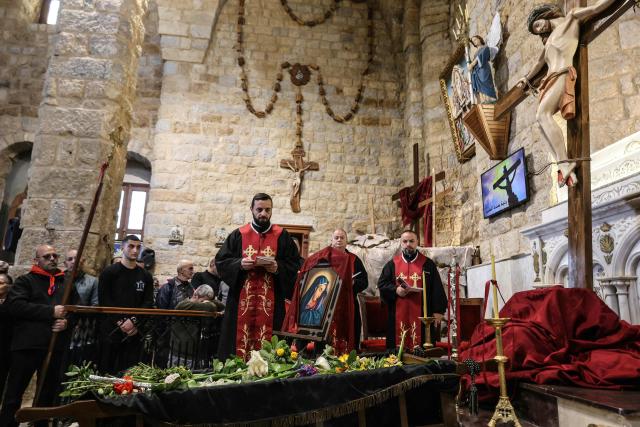 Lebanese Maronite Christians celebrate Good Friday in the southern border village of Qlayaa on April 3, 2026, amid the ongoing Middle East war. Lebanon was drawn into the Middle East war on March 2 when the Tehran-backed Hezbollah launched rockets at Israel to avenge the US-Israeli attack that killed Iran's supreme leader. Israel has responded with massive strikes across Lebanon as well as the ground operation. (Photo by AFP)