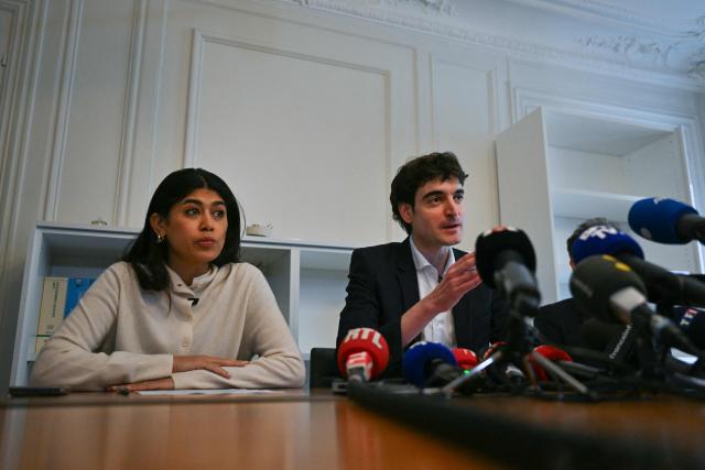 French-Palestinian member of the European Parliament Rima Hassan (L) and her lawyer Vincent Brengarth (R) give a press conference following a hearing at the regional headquarters of the judiciary police in Paris, France, on April 3, 2026. La France Insoumise (LFI) MEP Rima Hassan was again questioned by judicial police on April 3, 2026, as part of an investigation separate from the suspicion of "glorification of terrorism" for which she was placed in police custody the day before. During a search of her belongings on April 2, 2026, "the presence of substances resembling CBD on the one hand and 3MMC (a synthetic drug) on the other, about which she was questioned" was discovered, the prosecutor's office said at the end of her police custody, adding that "these elements were separate and will be subject to a distinct procedure". (Photo by Blanca CRUZ / AFP)