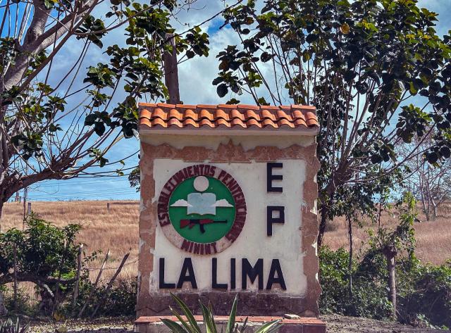 The sign at the entrance of the La Lima prison is pictured in Havana on April 3, 2026. A dozen prisoners were freed from a Havana prison on April 3, 2026, AFP journalists said, a day after the Cuban government said it would pardon 2,010 inmates in a "humanitarian" gesture for Holy Week. (Photo by YAMIL LAGE / AFP)