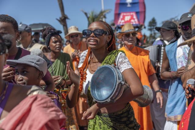 Hare Krishna devotees sing and dance on the Durban Promenade at the North Beach during the 35th annual Rathyatra (Festival of Chariots), in Durban on April 3, 2026. (Photo by RAJESH JANTILAL / AFP)