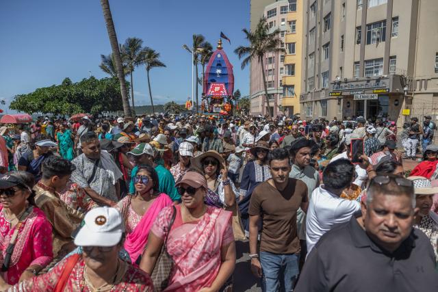 Hare Krishna devotees from all over South Africa pull one of the 3 metre chariots through North Beach during the 35th annual Rathyatra (Festival of Chariots), in Durban on April 3, 2026. (Photo by RAJESH JANTILAL / AFP)