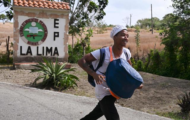A man smiles as he walks free from La Lima prison in Havana on April 3, 2026. Cuban authorities began to free prisoners on April 3, 2026, after announcing it would pardon 2,010 inmates, the second release in less than a month as it faces heightened US pressure. (Photo by YAMIL LAGE / AFP)