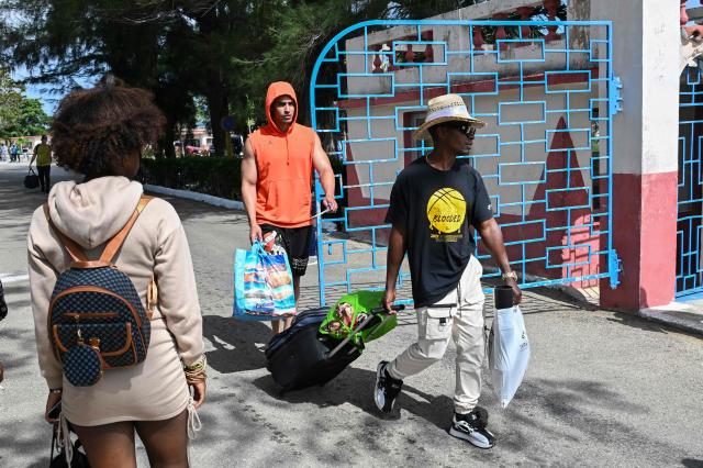 Inmates walk free from La Lima prison in Havana on April 3, 2026. Cuban authorities began to free prisoners on April 3, 2026, after announcing it would pardon 2,010 inmates, the second release in less than a month as it faces heightened US pressure. (Photo by YAMIL LAGE / AFP)