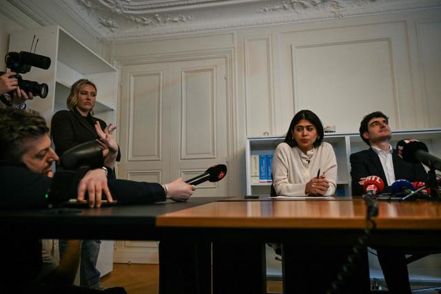 French-Palestinian member of the European Parliament Rima Hassan (C) and her lawyer Vincent Brengarth (R) give a press conference following a hearing at the regional headquarters of the judiciary police in Paris, France, on April 3, 2026. La France Insoumise (LFI) MEP Rima Hassan was again questioned by judicial police on April 3, 2026, as part of an investigation separate from the suspicion of "glorification of terrorism" for which she was placed in police custody the day before. During a search of her belongings on April 2, 2026, "the presence of substances resembling CBD on the one hand and 3MMC (a synthetic drug) on the other, about which she was questioned" was discovered, the prosecutor's office said at the end of her police custody, adding that "these elements were separate and will be subject to a distinct procedure". (Photo by Blanca CRUZ / AFP)