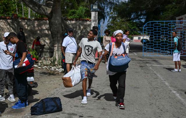 Inmates walk free from La Lima prison in Havana on April 3, 2026. Cuban authorities began to free prisoners on April 3, 2026, after announcing it would pardon 2,010 inmates, the second release in less than a month as it faces heightened US pressure. (Photo by YAMIL LAGE / AFP)