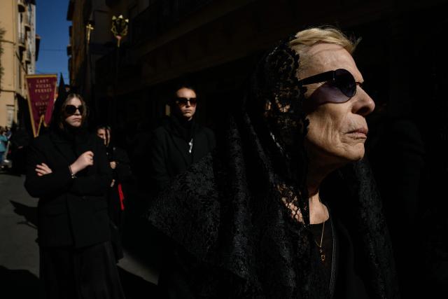 People take part in the Procession de la Sanch (Procession of Blood) in Perpignan on April 3, 2026. (Photo by Ed JONES / AFP)