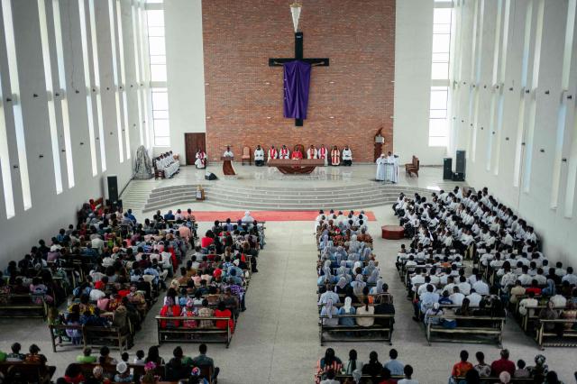 Catholic worshippers gather for a Good Friday service at the Bienheureuse Anuarite parish during Holy Week, ahead of Easter, in Goma on April 3, 2026. (Photo by Jospin Mwisha / AFP)