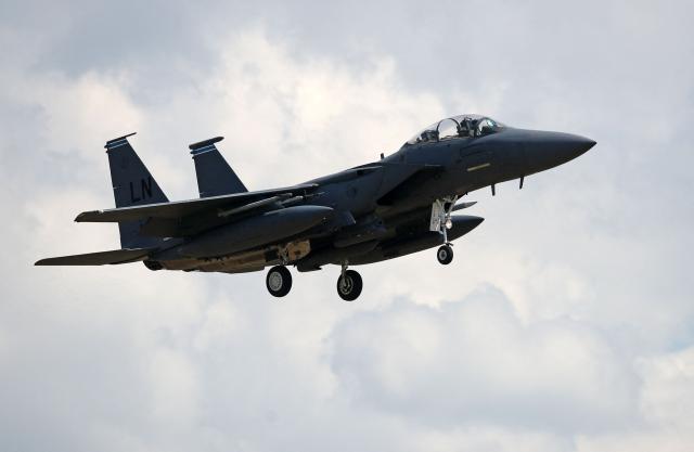 (FILES) A US Air Force (USAF) F-15E Eagle fighter jet, is pictured as it prepares to land at RAF (Royal Air Force) Lakenheath, east of England, on June 15, 2020. A US warplane has gone down over Iran and US forces have rescued one of the crew, major US media outlets reported on Friday 3, after Iranian media aired footage of aircraft wreckage. (Photo by CHRIS RADBURN / AFP)