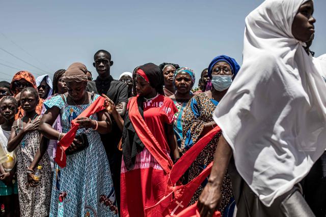 Worshippers take part in a Good Friday procession in Bakoteh, The Gambia, on April 3, 2026. (Photo by MUHAMADOU BITTAYE / AFP)