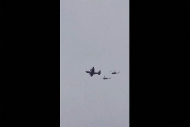 This video grab taken on April 3, 2026, from UGC images posted on social media on April 3, 2026 show a US aircraft, followed by two helicopters, flying over the town of Zaras in the southern Iran's Khuzestan province. (Photo by UGC / AFP) / Israel OUT / AFPTV TEAMS IN PARIS WERE ABLE TO VERIFY THE LOCATION OF THE VIDEOS THROUGH SATELLITE IMAGES. THE VIDEOS WERE FILMED IN ZARAS, IRAN. WE WERE UNABLE TO CONTACT THE AUTHORS OF THE VIDEOS. GPS COORDINATES: 31.591042143943394, 50.27496992971525 
Attention editors: AFP is covering the war in the Middle East through its extensive regional network, including its bureaus in Tehran, Beirut, Jerusalem, the Gulf monarchies, Iraq, Jordan, Syria and Egypt. However, since the start of the war, the agency's journalists have been working under increasingly restrictive conditions. Governments throughout the region have imposed limits on journalists' movements, including their ability to provide video live streams of what are regarded as sensitive locations. Several governments and armed groups have banned photo and video coverage of missile and drone strikes on what are seen as security-related sites, the interception of incoming missiles and drones, and the reporting of what could be construed as operational military details. / 