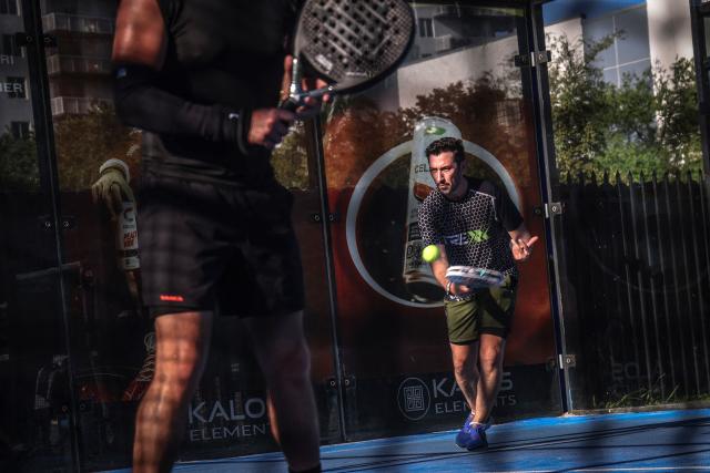 People play padel on a court in Miami, Florida, on March 22, 2026. Padel, the racket sport that originated among the elites of Latin America and Spain, has exploded in popularity in Miami. Fans say it will conquer the rest of the United States, and the world. (Photo by Giorgio Viera / AFP)