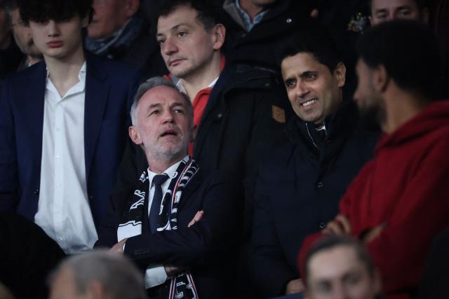 Paris' Mayor Emmanuel Gregoire (2nd L) looks on flanked by Paris Saint Germain's Qatari president Nasser al-Khelaifi (R) during the French L1 football match between Paris Saint-Germain (PSG) and Toulouse FC at the Parc des Princes stadium in Paris on April 3, 2026. (Photo by Anne-Christine POUJOULAT / AFP)