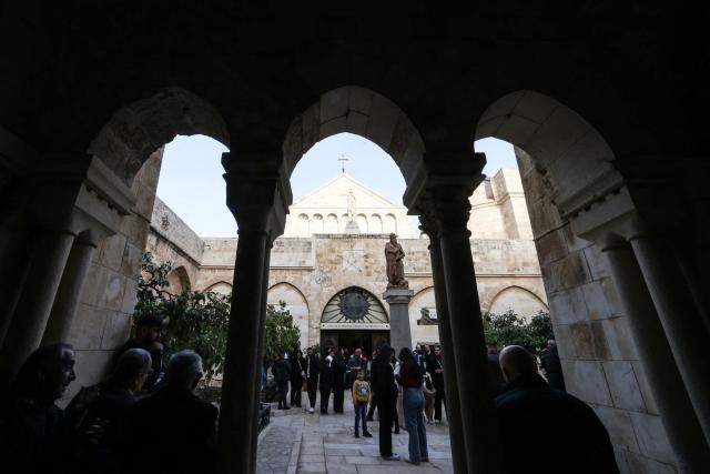 Palestinian Christian worshippers gather for a Good Friday mass at the Catholic Church of Saint Catherine in the Israeli-occupied West Bank city of Bethlehem on April 3, 2026. (Photo by HAZEM BADER / AFP)