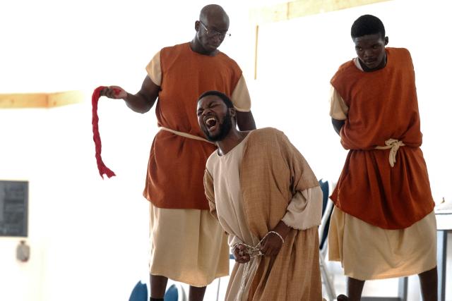 Christian faithful perform an interpretation of the life of Jesus Christ during the Stations of the Cross, at the Saint Christophe parish in Yoff in Dakar, on April 3, 2026. (Photo by SEYLLOU / AFP)