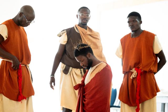 Christian faithful perform an interpretation of the life of Jesus Christ during the Stations of the Cross, at the Saint Christophe parish in Yoff in Dakar, on April 3, 2026. (Photo by SEYLLOU / AFP)