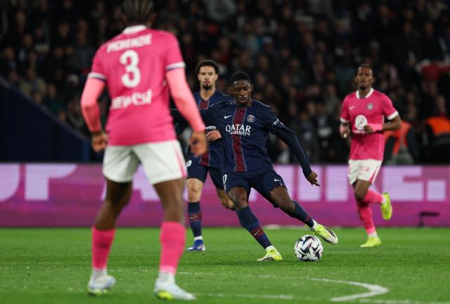 Paris Saint-Germain's French forward #10 Ousmane Dembele (C) controls the ball during the French L1 football match between Paris Saint-Germain (PSG) and Toulouse FC at the Parc des Princes stadium in Paris on April 3, 2026. (Photo by Anne-Christine POUJOULAT / AFP)