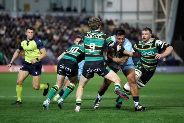 Castres' New Zealand number 8 Abraham Papalii is tackled by Northampton Saints' French scrum half Archie McParland during the European Rugby Champions Cup round of 16 rugby union match, between Northampton Saints and Castres Olympique at Franklin's Gardens in Northampton, central England, on April 3, 2026. (Photo by Darren Staples / AFP)