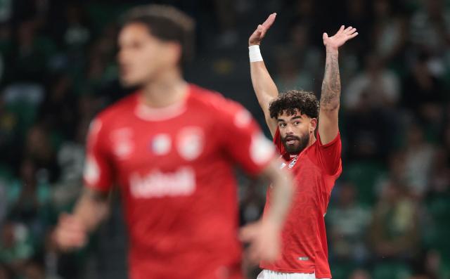 Santa Clara's Portuguese forward #77 Henrique Pereira celebrates after scoring the opening goal during the Portuguese League football match between Sporting CP and CD Santa Clara at Jose Alvalade stadium in Lisbon on April 3, 2026. (Photo by PATRICIA DE MELO MOREIRA / AFP)