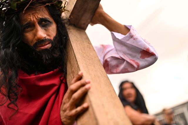 A man portrays Jesus Christ during the Good Friday procession in Panama City on April 03, 2026. (Photo by MARTIN BERNETTI / AFP)