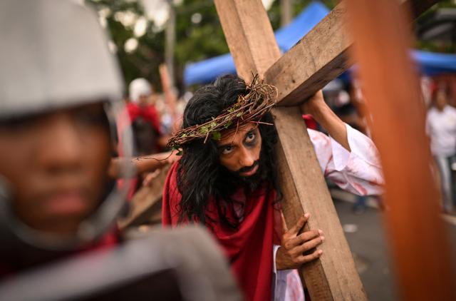 A man portrays Jesus Christ during the Good Friday procession in Panama City on April 03, 2026. (Photo by MARTIN BERNETTI / AFP)