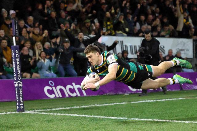 Northampton Saints' English wing Tommy Freeman dives to score the team's fourth try during the European Rugby Champions Cup round of 16 rugby union match, between Northampton Saints and Castres Olympique at Franklin's Gardens in Northampton, central England, on April 3, 2026. (Photo by Darren Staples / AFP)